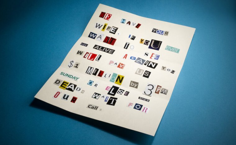 Stock photo of ransom note with letters cut out of newspapers and magazines.