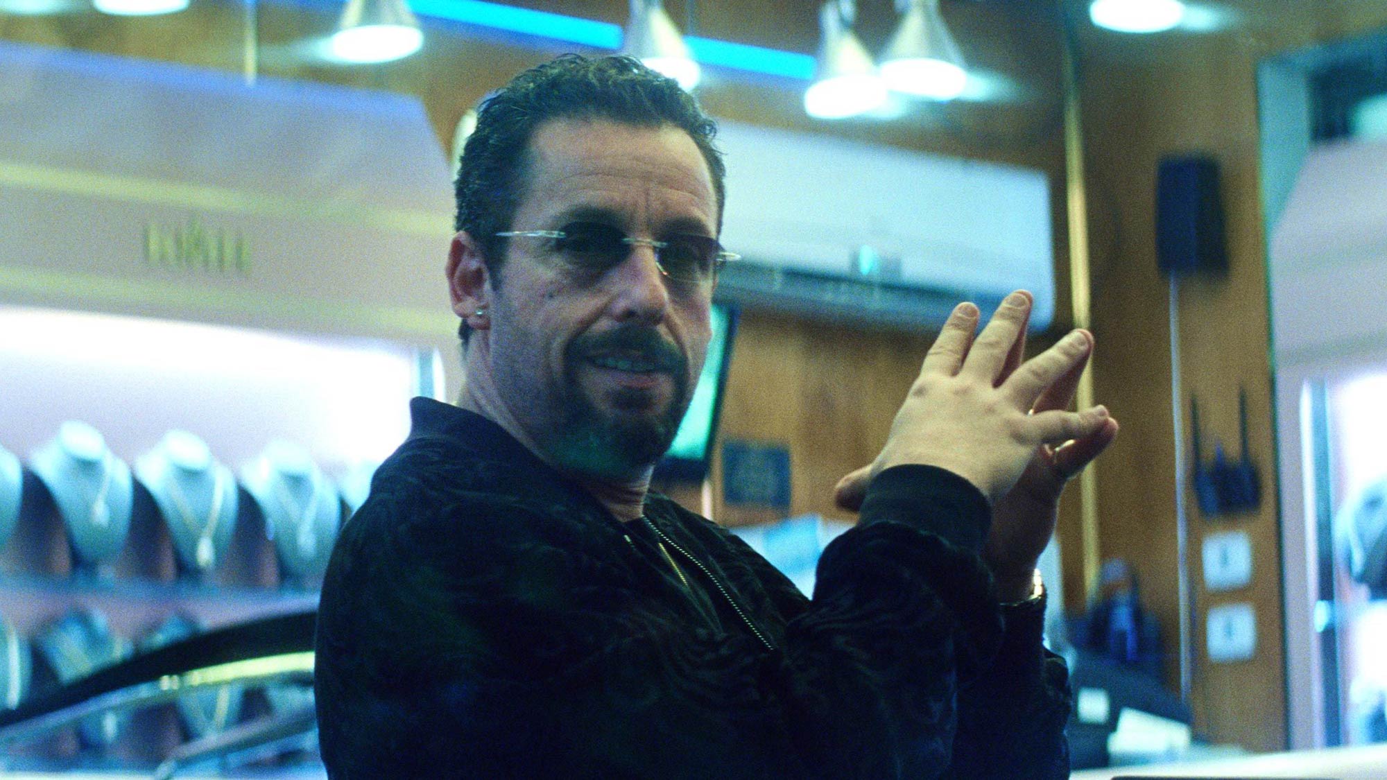 Adam Sandler as Howard Ratner in Uncut Gems, one of the best Netflix movies