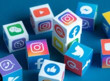A group of cubes all displaying social media logos