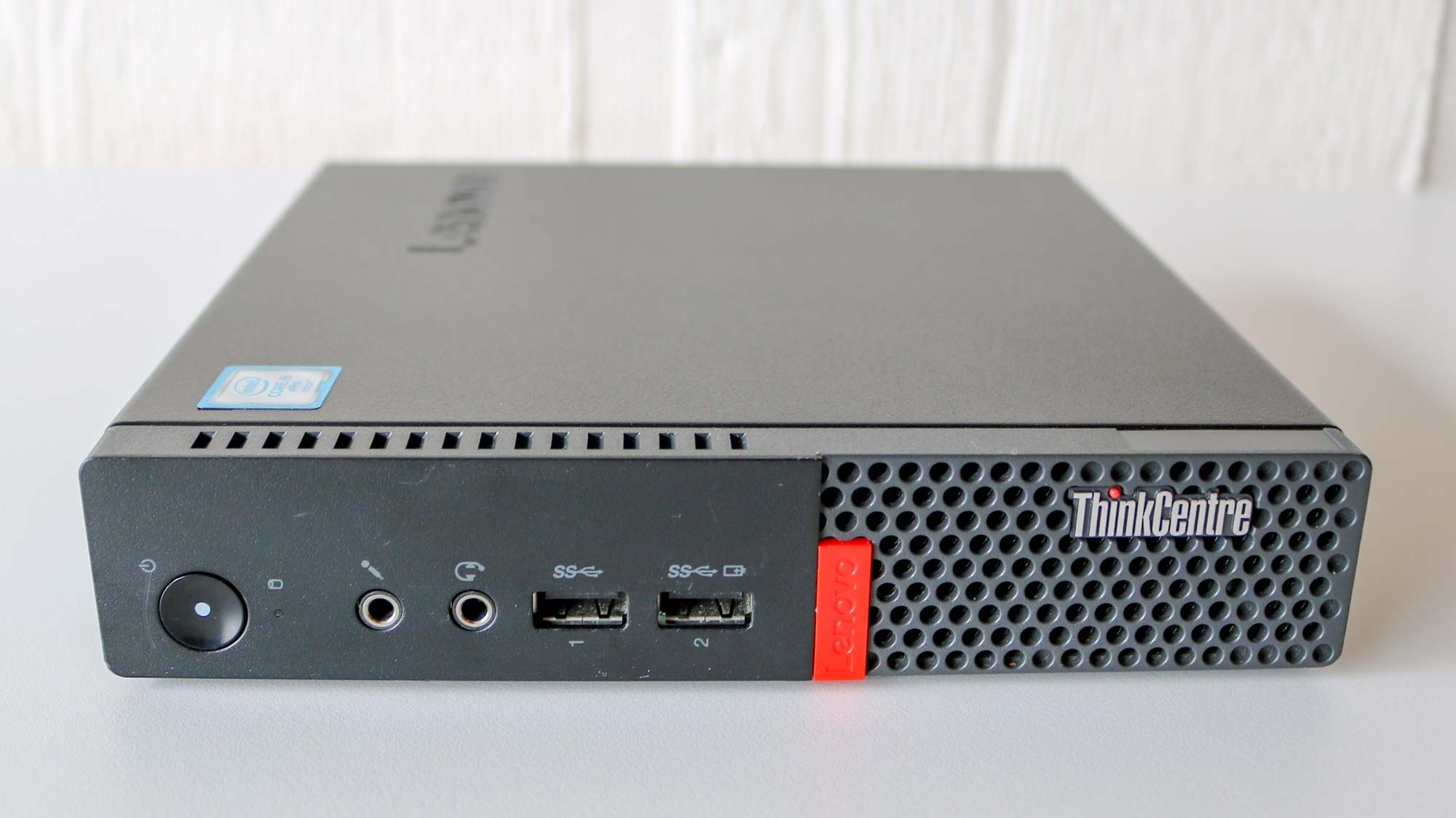 A Lenovo ThinkCentre Tiny laying horizontally