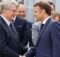 French President Emmanuel Macron (R) shakes hands with EU commissioner for internal market Thierry Breton as he visits the International Paris Air Show at the ParisLe Bourget Airport on June 19, 2023.